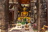 Modern Buddha statues in the central sanctuary of the mountain temple Wat Phu, Champasak Province, Laos, Asia