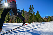 Person cross-country skiing runs through the Kloo-Aschertal, Bayrischzell, Mangfall Mountains, Bavarian Alps, Upper Bavaria, Bavaria, Germany