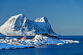 Snow-covered houses and mountains at Nordfjord, Nordfjord, Senja, Troms og Finnmark, Norway