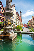 Fountains and historical buildings in Rothenburg ob der Tauber, Middle Franconia, Bavaria, Germany