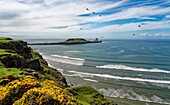 Great Britain, Wales, Gower Peninsula, Rhossily beach with view of Worms head (headland accessible at low tide)