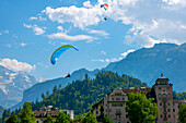 Paragliding and Snow Capped Jungfraujoch Mountain in a Sunny Day in Interlaken, Bern Canton, Switzerland.