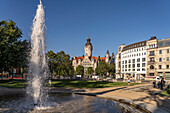 Fountain of the Fritz von Harck complex and the New Town Hall in Leipzig, Saxony, Germany