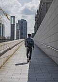 Tourist walks through the streets of Berlin, Germany.