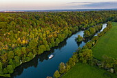 Aerial view of a Le Boat Horizon 4 houseboat on the River Thames with island near Cliveden National Trust, near Maidenhead, Berkshire, England, United Kingdom