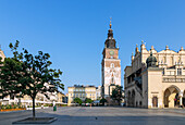 Rynek Glówny with Cloth Hall (Sukienice) and Town Hall Tower in the morning light in the old town of Kraków in Poland