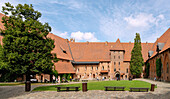 Inner courtyard of the central castle of the Marienburg (Zamek w Malborku) with a monumental figure of the Virgin Mary in Malbork in the Pomorskie Voivodeship in Poland