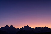 Evening sky with the silhouettes of Outer Horn, Inner Horn, Bell and Cathedral Peak, Didima, Cathedral Peak, Drakensberg, Kwa Zulu Natal, UNESCO World Heritage Site Maloti-Drakensberg, South Africa