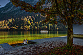 Mother and child look at the lake, tourist boat trip/shipping on the Königssee, Königssee with St. Bartholomä Church in front of the Watzmann east wall, Königssee, Berchtesgaden National Park, Berchtesgaden Alps, Upper Bavaria, Bavaria, Germany