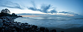 Stone coast on the Baltic Sea shortly before sunrise, bizarre clouds, dawn on the horizon, Mön Island, Denmark