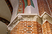 Column capitals with figure reliefs in the interior of the Cathedral of the Assumption and St. Adalbert (Gniezno Cathedral; Archcathedral of Gniezno; Primate Basilica of the Assumption of Our Lady; Bazylika archikatedralna Wniebowzięcia NMP) in Gniezno (Gniezno) in the Wielkopolska Voivodeship of Poland