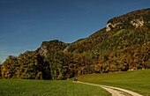 Hiking couple on a hiking trail in the autumn landscape near St. Wolfgang, Salzkammergut, Austria