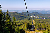 Cable car (Kolej Linowa) from Karpacz to the Little Koppe (Mala Kopa) to the hiking trail to the Sněžka (Śnieżka; Sniezka) in the Giant Mountains National Park (Karkonoski Park Narodowy) and view of the hotel resort in Karpacz in the Dolnośląskie Voivodeship of Poland