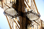 Double exposure of a glass and steel overhang in front of a shop in Bordeaux, France.