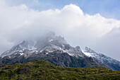 Chile; Southern Chile; Magallanes Region; Mountains of the southern Cordillera Patagonica; Torres del Paine National Park; Clouds over the summit of Cerro Paine Grande