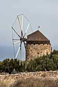 Old mill in olive trees in Greece