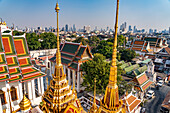 the Buddhist temple complex Wat Ratchanatdaram and the skyline, Bangkok, Thailand, Asia