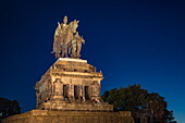 Illuminated equestrian statue of German Emperor Wilhelm I at Deutsches Eck at night, Koblenz, Rhineland-Palatinate, Germany, Europe