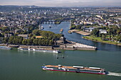 River cruise ship Rhein Melodie (nicko cruises) passes Deutsches Eck at the confluence of the Moselle and Rhine as seen from Ehrenbreitstein Fortress, Koblenz, Rhineland-Palatinate, Germany, Europe