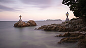 View of lanterns on rocks in the sea at a shrine, Yaotomi Shrine, Gamagōri, Aichi Prefecture, Japan, Asia