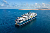  Aerial view of the expedition cruise ship SH Diana (Swan Hellenic) approaching Socotra, near Hadibu, Socotra Island, Yemen, Middle East 