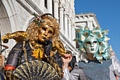  Masks in front of the Doge&#39;s Palace at Venice Carnival, Venice, Italy 