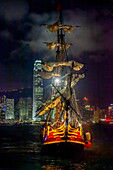  Sailing ship in front of the skyline of Hong Kong Island, Hong Kong 