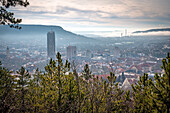  View of the city of Jena with the Jentower (Uniturm) and the Kernberg mountains in the background, in low fog in the morning, Jena, Thuringia, Germany 