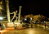  Statue of the Pillars of Hercules on the seafront of Ceuta at night, Strait of Gibraltar, Spain 