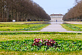  New Schleissheim Palace and palace park with view of the canal and walkers in Oberschleißheim Upper Bavaria, Germany 