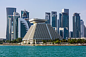  Harbor views with skyscrapers and ships in Doha, capital of Qatar in the Persian Gulf. 