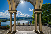  People looking at lake, view of Isola San Giulio from Sacro Monte d&#39;Orta pilgrimage site World Heritage Site, Lake Orta is a northern Italian lake in the northern Italian, Lago d&#39;Orta, or Cusio, region of Piedmont, Italy, Europe 