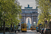  Old yellow tram in front of the Arco della Pace (Arch of Peace) triumphal arch Piazza Sempione not far from the Castello Sforzesco, Metropolitan City of Milan, Metropolitan Region, Lombardy, Italy, Europe 