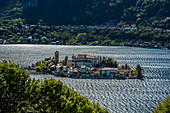  View of Isola San Giulio from the Sacro Monte d&#39;Orta pilgrimage site World Heritage Site, Lake Orta is a northern Italian lake in the northern Italian, Lago d&#39;Orta, or Cusio, region of Piedmont, Italy, Europe 