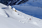  Woman on ski tour ascending to Junsjoch, Junsjoch, Tux Alps, Tyrol, Austria 