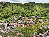  View from the hiking trail to a village in the valley, Swabian Alb, Baden-Württemberg, Germany 