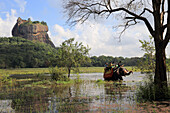 Elephant ride in lake by rock palace, Sigiriya, Central Province, Sri Lanka, Asia
