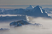  Iceberg in cold mist, Kangia Icefjord, UNESCO World Heritage Site, Disko Bay, West Greenland, Greenland 