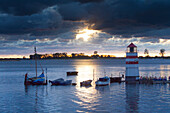  Evening atmosphere at the harbor of the island of Ummanz, island of Ruegen, Mecklenburg-Western Pomerania, Germany 
