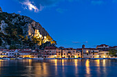  The old town of Omis on the river Cetina with the ruins of the fortress Mirabella or Peovica at dusk, Croatia, Europe  