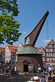  Wooden treadle crane at the old town harbor, Hanseatic City of Stade, Altes Land, Lower Saxony, Germany 