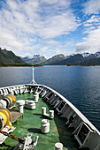 Hurtigruten ferry ship approaching the southern coast of Hinnoya Island, Nordland, northern Norway