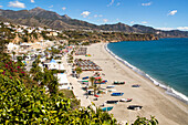 Playa Burriana sandy beach at popular holiday resort town of Nerja, Malaga province, Spain