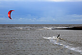 Kite surfing in North Sea at Shingle Street, Suffolk, England, UK
