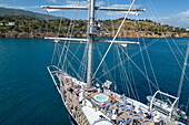  Aerial view of passengers climbing the mast on board the sailing cruise ship Running on Waves (M&#39;Ocean), Poros, Attica, Greece, Europe 