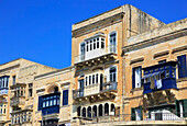Balconies of historic houses in city centre of Valletta, Malta