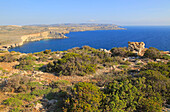Coastal scenery vegetation blue sea looking south from Res il-Qammieh, Marfa Peninsula, Republic of Malta