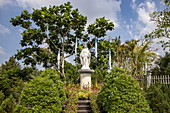  Religious statue in the garden in front of the Catholic Church Cay Lay, Cai Lay (Cái Lậy), Tien Giang (Tiền Giang), Vietnam, Asia 
