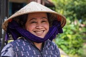  Friendly Vietnamese woman with conical hat, Cai Lay (Cái Lậy), Tien Giang (Tiền Giang), Vietnam, Asia 