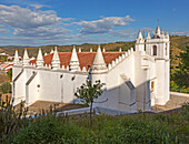 Architectural details of conical roof decorations historic whitewashed church Igreja Matrix in medieval village of Mértola, Baixo Alentejo, Portugal, Southern Europe